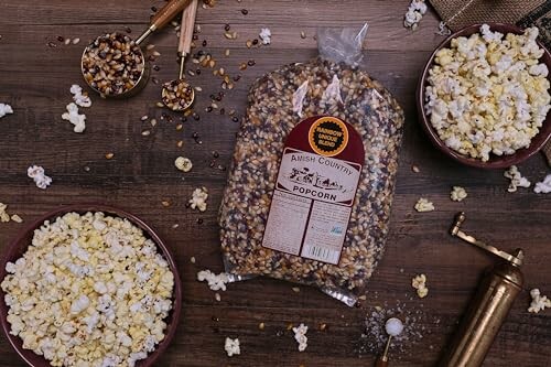 Amish Country popcorn kernels and popped popcorn on a table.